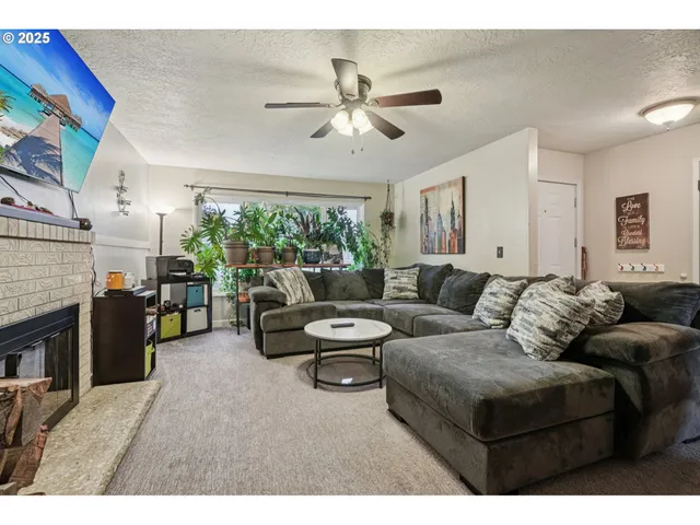 a living room with furniture and fireplace