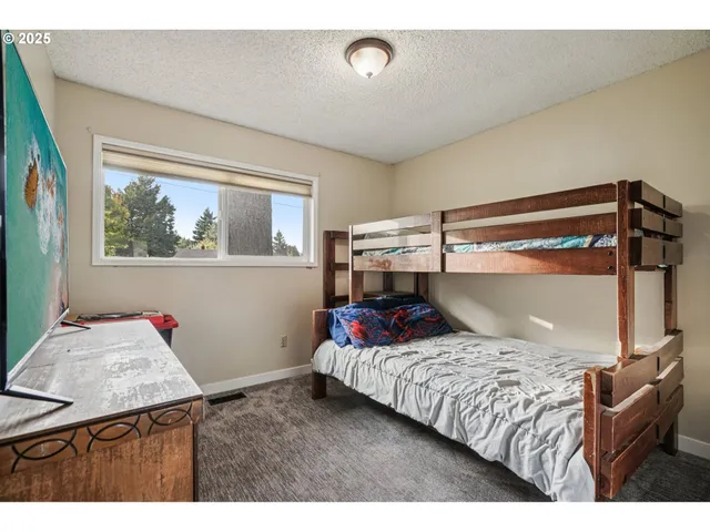 a bedroom with a bed and a cabinets