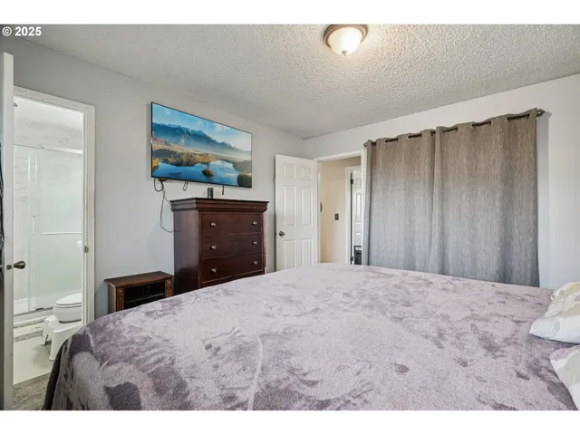 a bathroom with a sink vanity mirror and shower