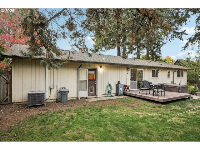 a balcony with table and chairs