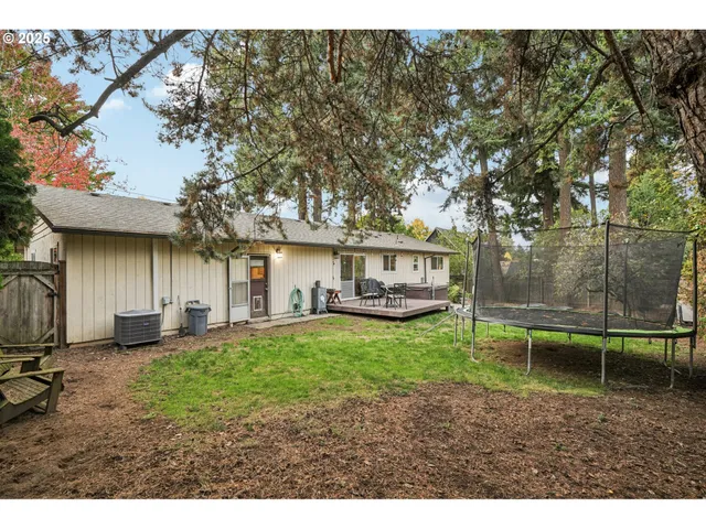 a backyard of a house with lots of green space