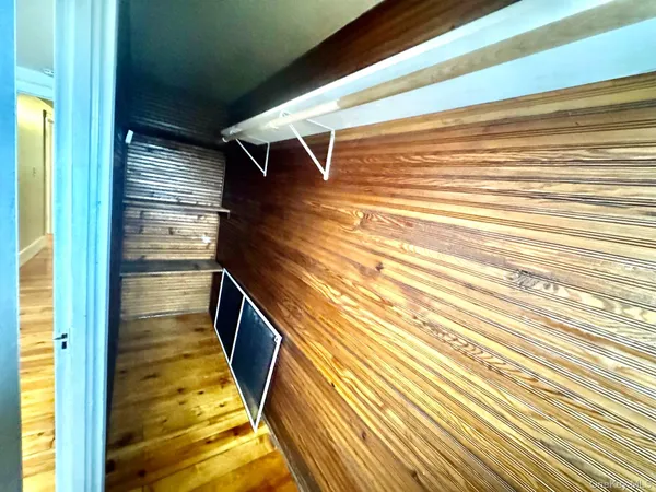 a hallway with a white cabinets