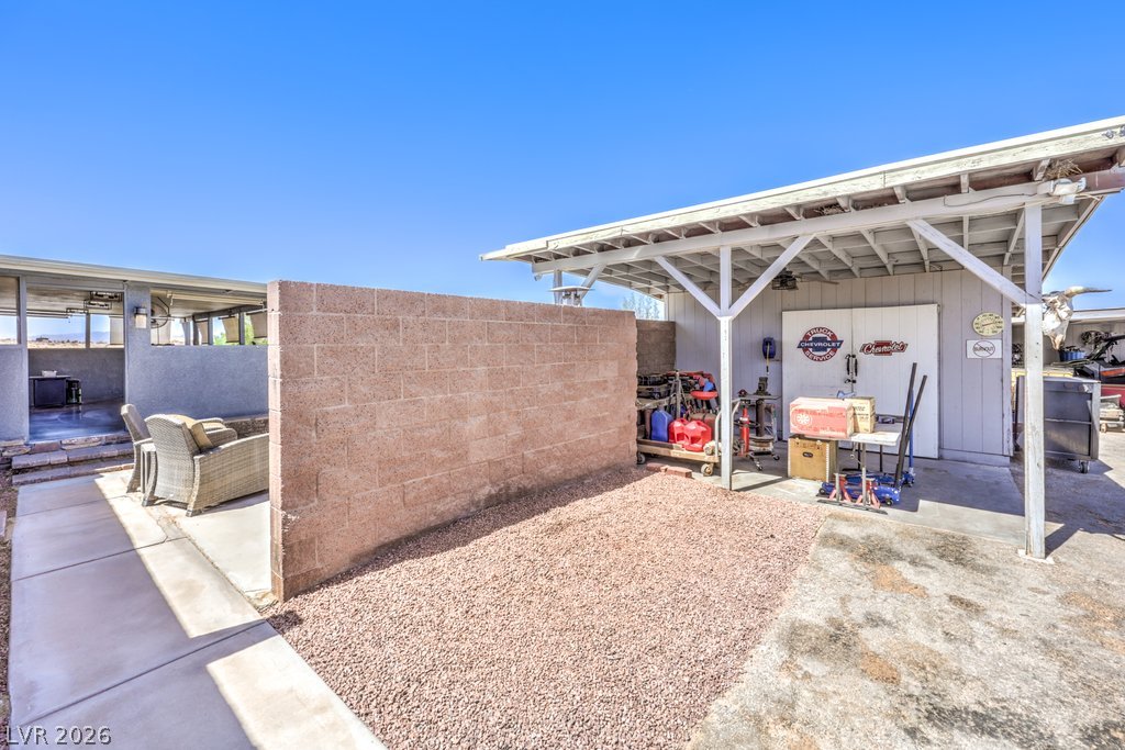 4375 Pinwheel Street Logandale, NV 89021 - Photo 36 of 52 A well-organized utility area provides ample storage and workspace, with a separate shaded patio for relaxation.