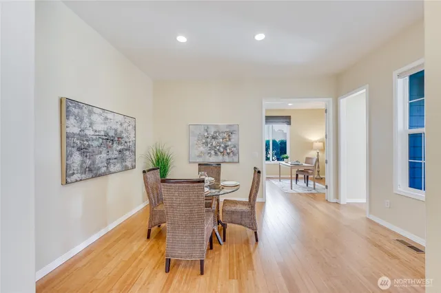 a view of a dining room with furniture window and wooden floor