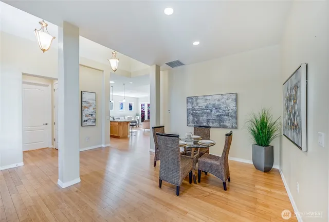 a view of a livingroom with furniture and a potted plant