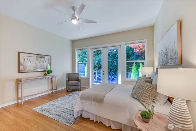 a bedroom with a bed a couch and a window