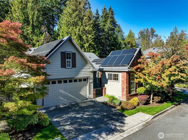 a view of a house with a yard and plants