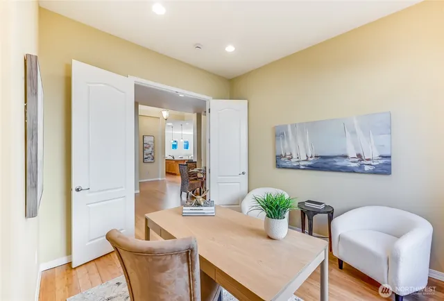 a living room with furniture and a potted plant