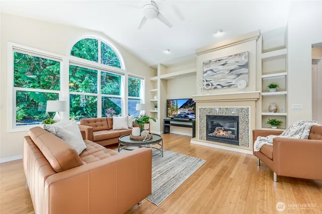 a living room with furniture and a fireplace