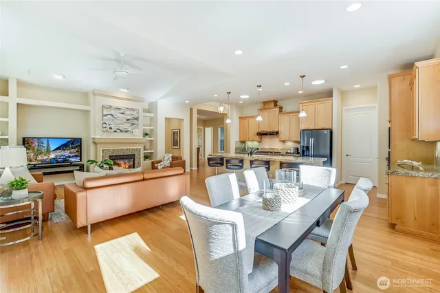 a large kitchen with a table and chairs in it