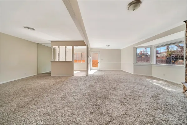 a view of entryway with wooden floor and door