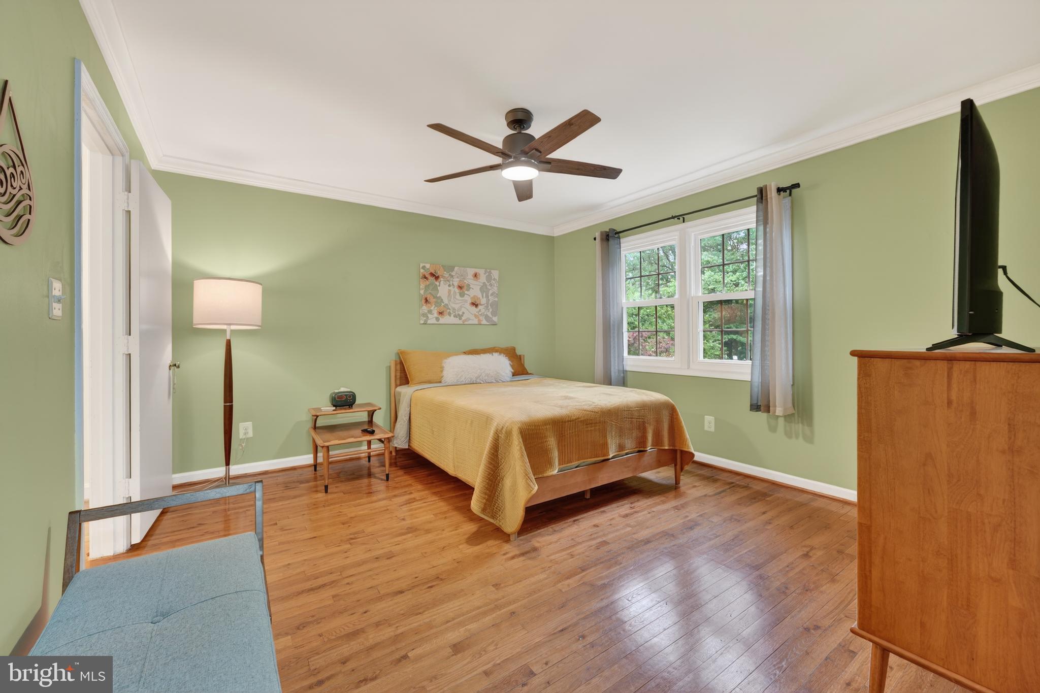 8139 Carrleigh Parkway Springfield, VA 22152 - Photo 17 of 27 a bedroom with a bed and a window