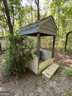 809 John W Breedlove Road Monroe, GA 30656 - Photo 11 of 11 a view of a backyard with a shade house and large tree