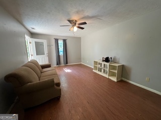 809 John W Breedlove Road Monroe, GA 30656 - Photo 9 of 11 a living room with furniture and a chandelier