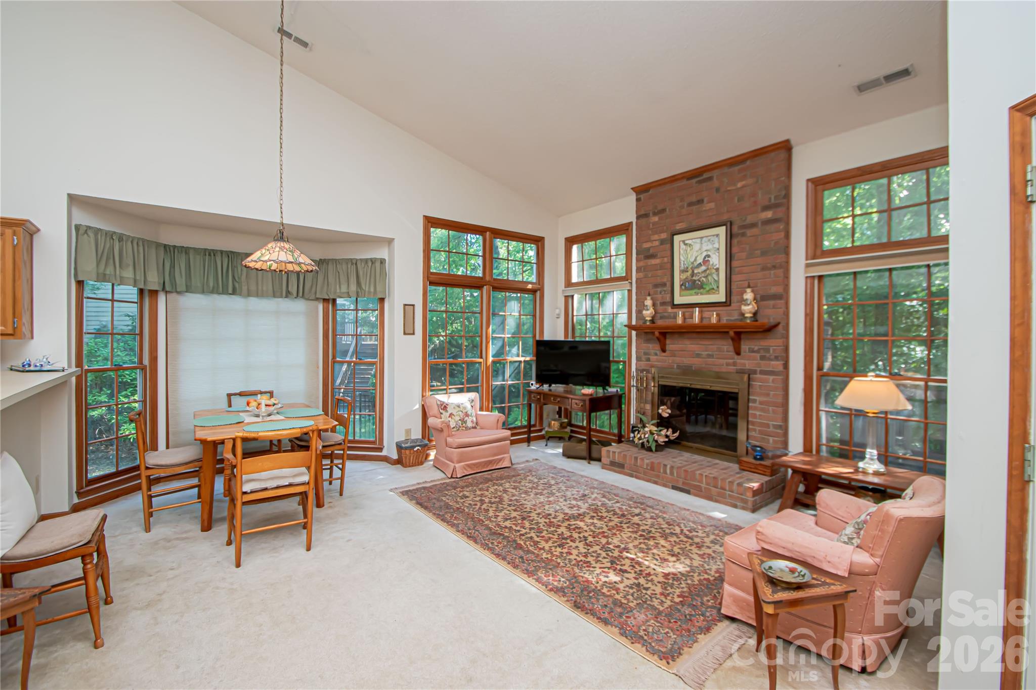 10801 Whitfield Ridge Drive Charlotte, NC 28277 - Photo 12 of 47 a living room with furniture a fireplace and large windows