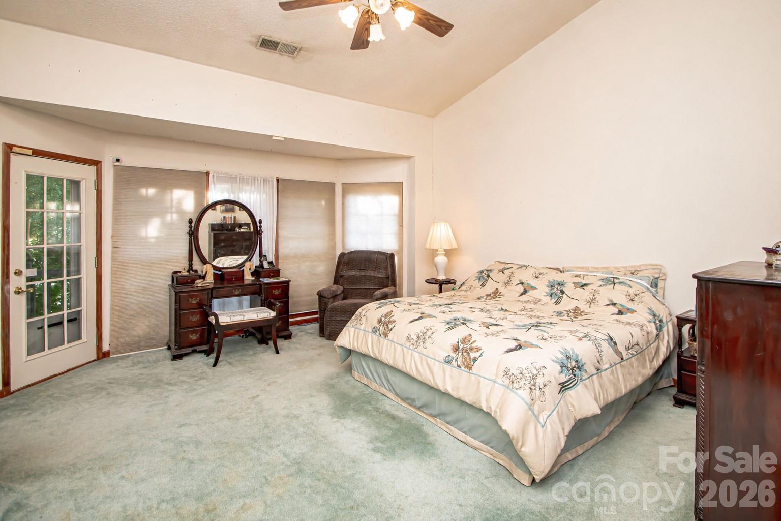 10801 Whitfield Ridge Drive Charlotte, NC 28277 - Photo 20 of 47 a bedroom with a bed and a chandelier