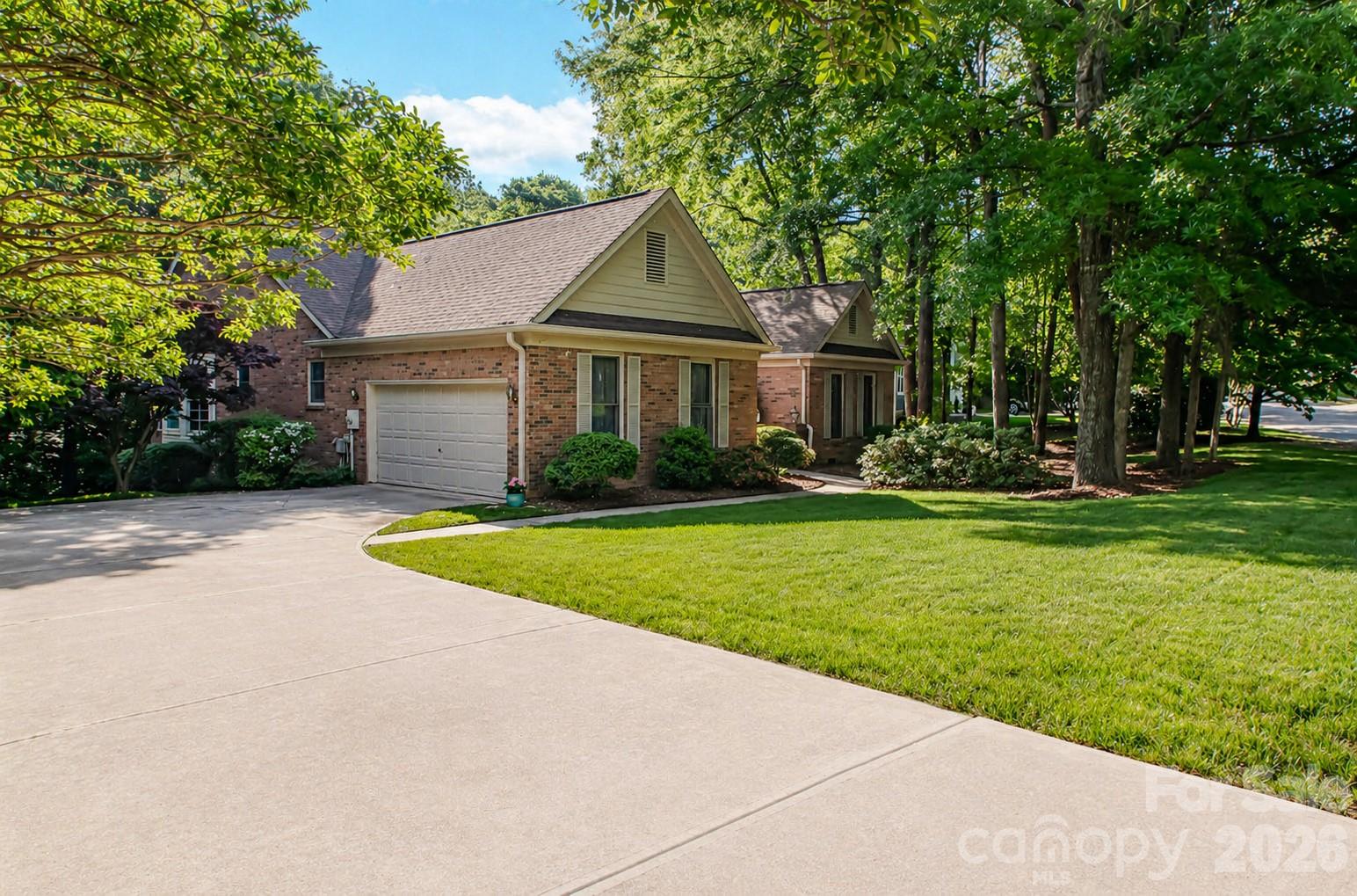 10801 Whitfield Ridge Drive Charlotte, NC 28277 - Photo 2 of 47 a front view of a house with garden