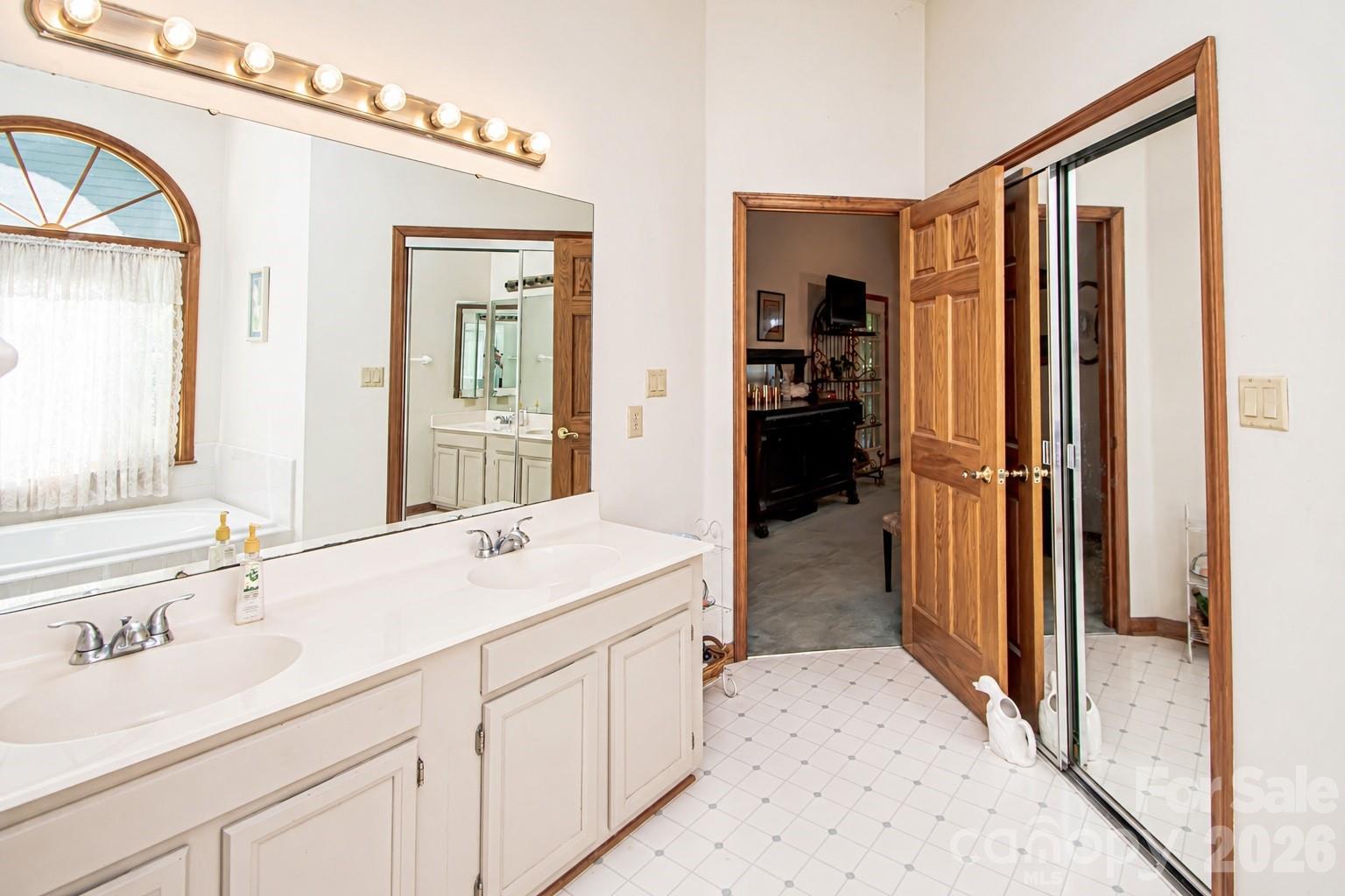10801 Whitfield Ridge Drive Charlotte, NC 28277 - Photo 23 of 47 a en suite bathroom with a sink double vanity and a mirror