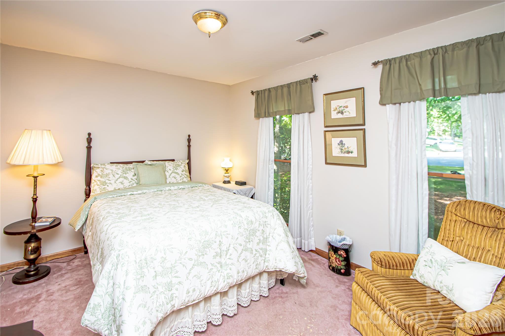 10801 Whitfield Ridge Drive Charlotte, NC 28277 - Photo 25 of 47 a bedroom with a bed and a lamp
