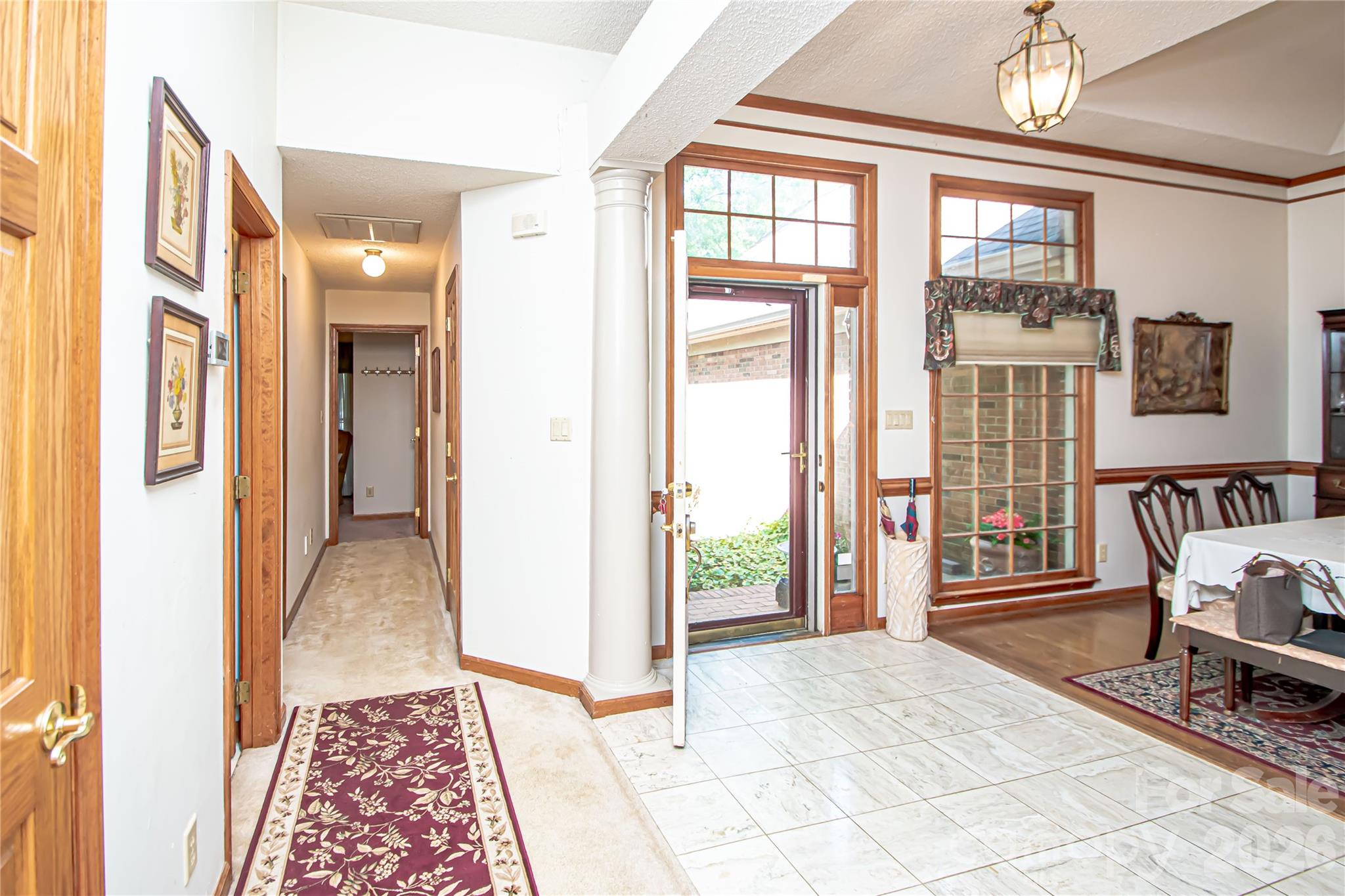 10801 Whitfield Ridge Drive Charlotte, NC 28277 - Photo 10 of 47 a view of a hallway with wooden floor and windows