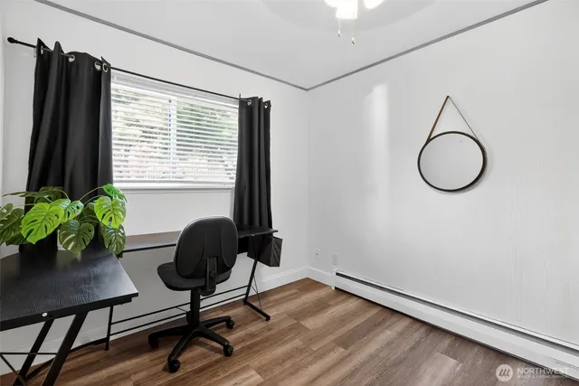 a view of a workspace room with gym equipment