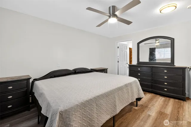 a bedroom with a bed and a dresser