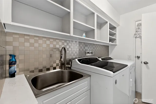 a kitchen with a sink and a stove