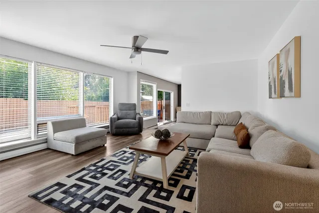 a living room with furniture and a large window