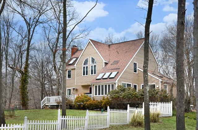 262 Wilton Road East Ridgefield, CT 06877 - Photo 1 of 1 a front view of a house with a yard
