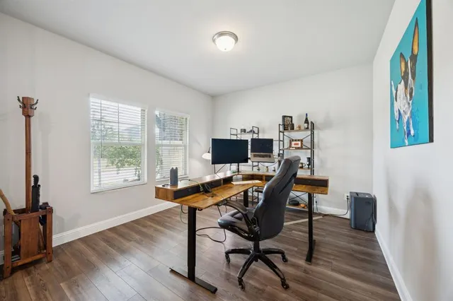 a workspace with wooden floor
