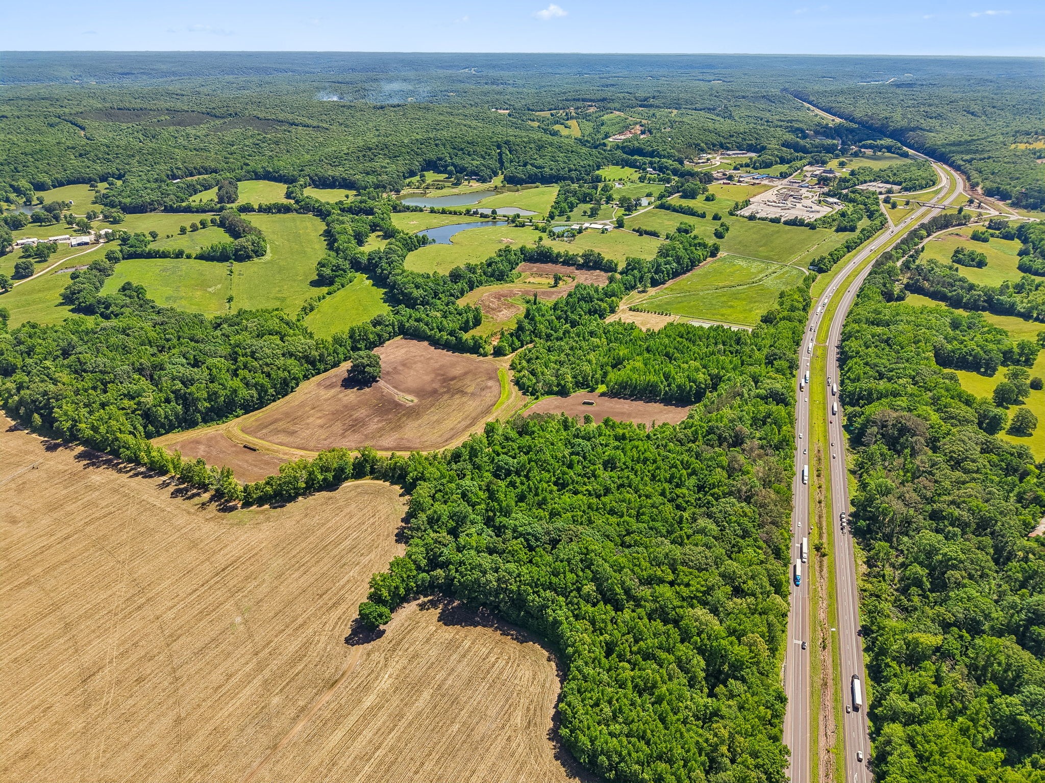 0 Rochelle Lane Hurricane Mills, TN 37078 - Photo 16 of 69 an aerial view of green landscape with trees houses and mountain view