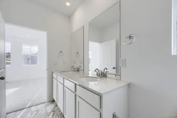 a bathroom with a sink a mirror and a bathtub