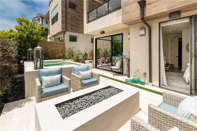 a building outdoor space with patio couch and glass door