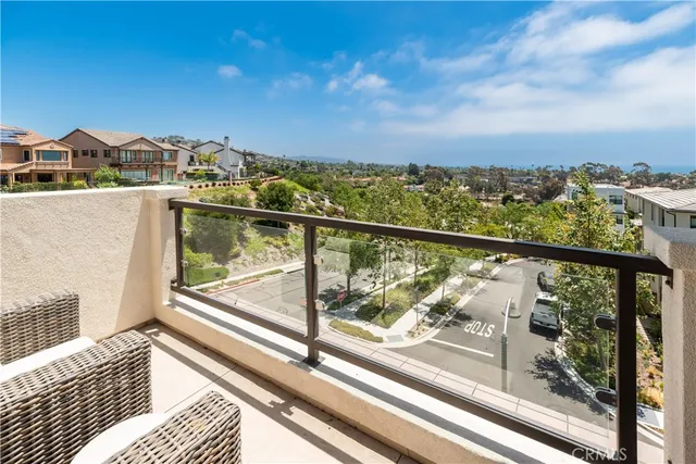 a view of a balcony with wooden floor and city view