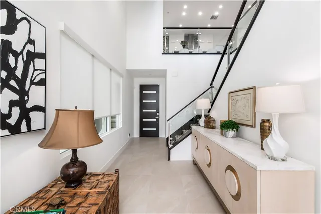 a view of hallway with furniture and a window