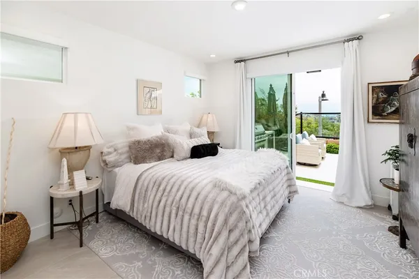 a bedroom with a bed and a table