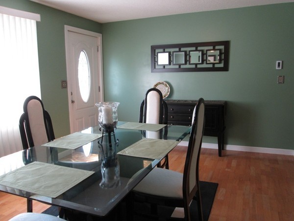 64 Brookside Avenue Webster, MA 01570 - Photo 11 of 30 a view of a dining room with furniture and wooden floor
