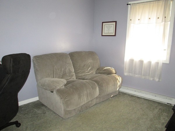64 Brookside Avenue Webster, MA 01570 - Photo 17 of 30 a living room with furniture and a window