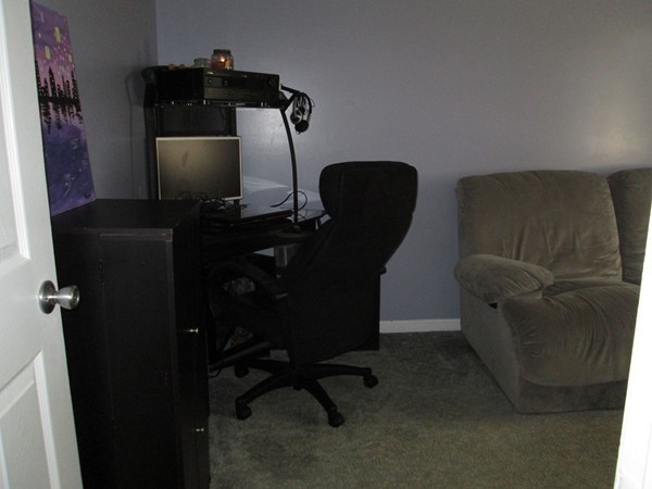 64 Brookside Avenue Webster, MA 01570 - Photo 18 of 30 a living room with furniture and a flat screen tv