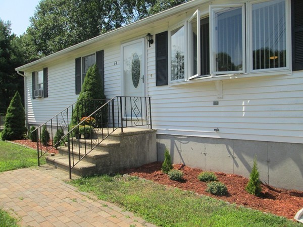 64 Brookside Avenue Webster, MA 01570 - Photo 2 of 30 a view of a house with a small yard and sitting area