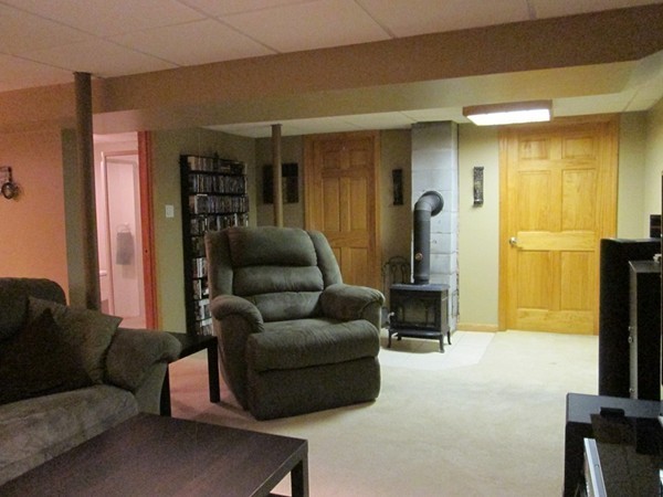 64 Brookside Avenue Webster, MA 01570 - Photo 22 of 30 a living room with furniture and a flat screen tv