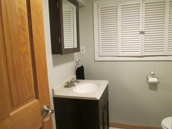 64 Brookside Avenue Webster, MA 01570 - Photo 25 of 30 a bathroom with a sink a toilet and a window