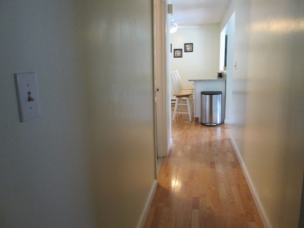 64 Brookside Avenue Webster, MA 01570 - Photo 30 of 30 a view of a hallway with wooden floor