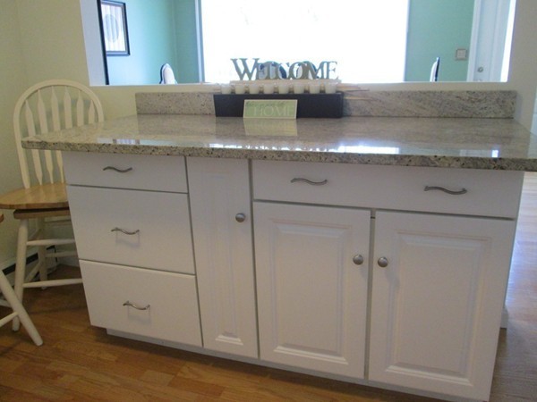 64 Brookside Avenue Webster, MA 01570 - Photo 6 of 30 a view of cabinets with wooden floor