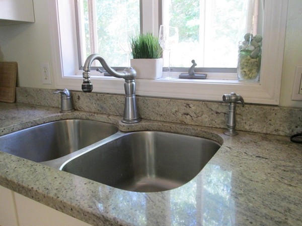 64 Brookside Avenue Webster, MA 01570 - Photo 7 of 30 a view of a kitchen counter top a sink and a window