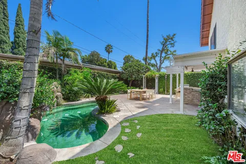 a view of a backyard with a patio