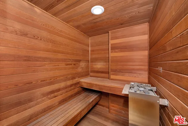 a bedroom with a bed and a desk