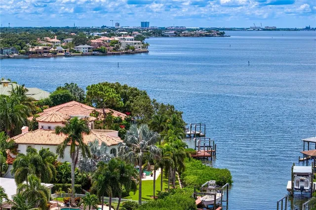 an aerial view of a house with a lake view