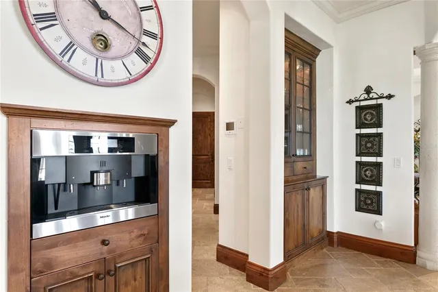 a room with pool table and windows