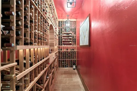 a room with lots of furniture and a chandelier